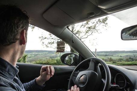 man driving in the countryside
